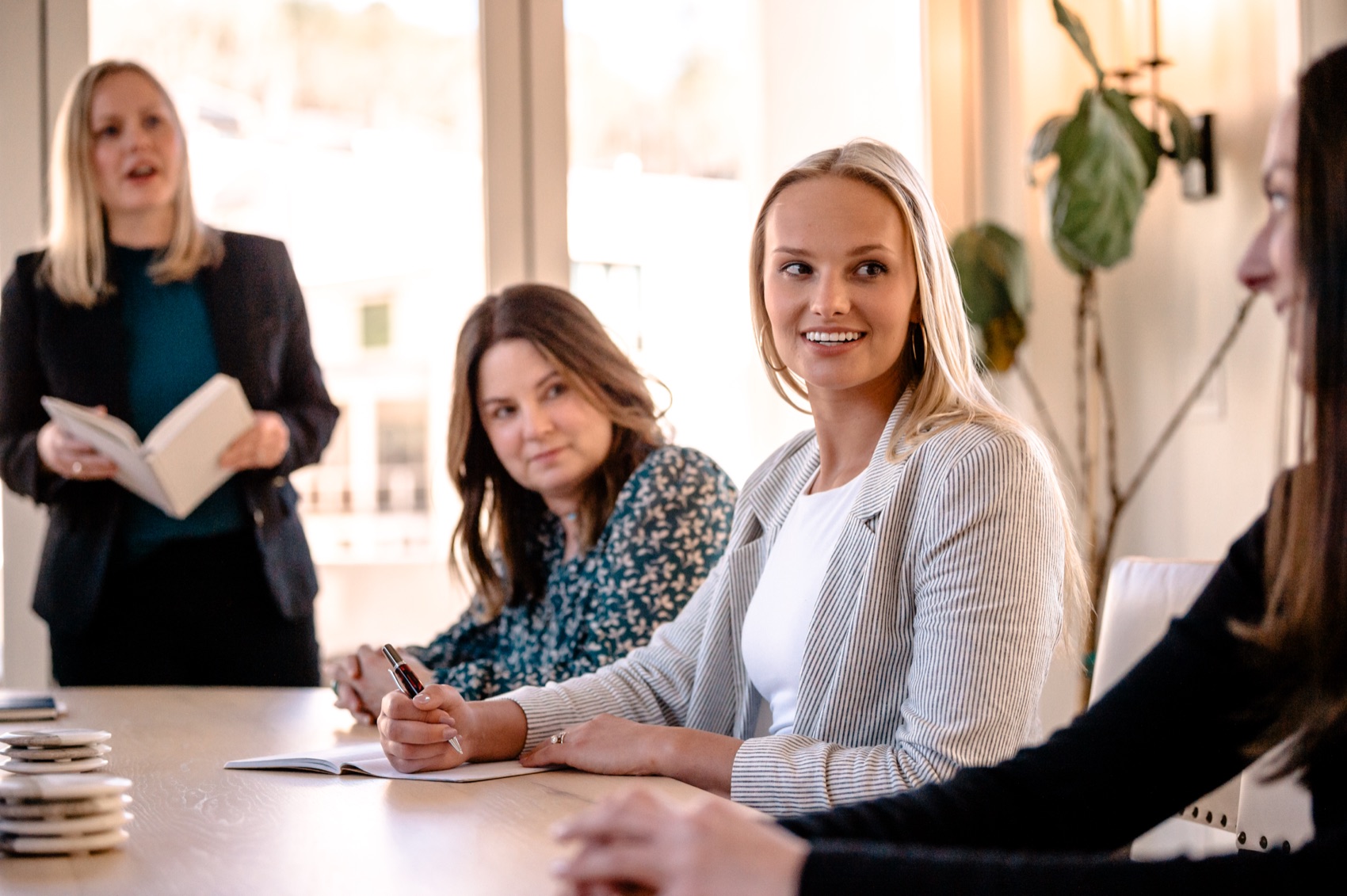 Guardian team members in conversation at the table